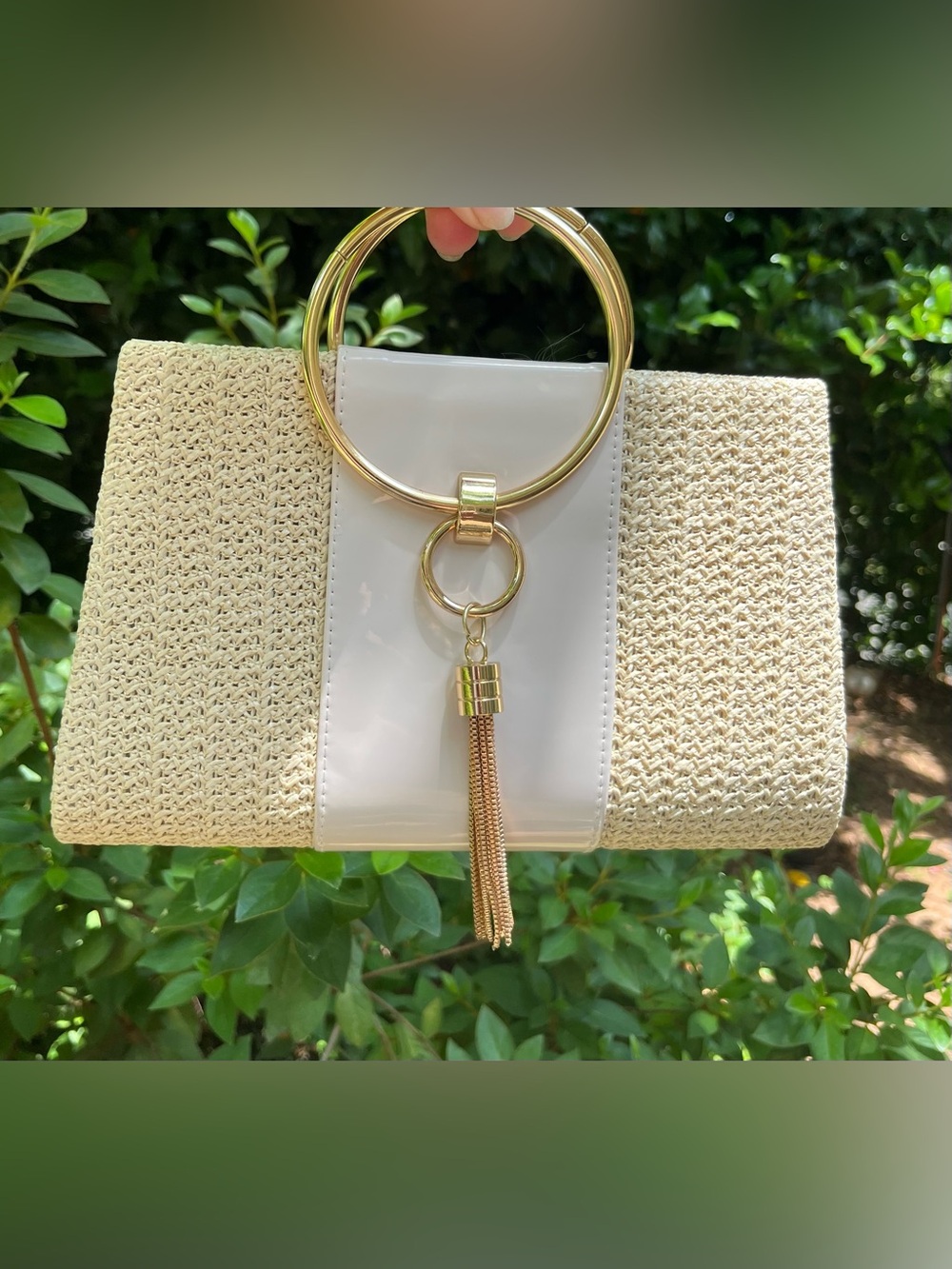NEW. Cream Woven Clutch with Gold Ring Handle and Tassel